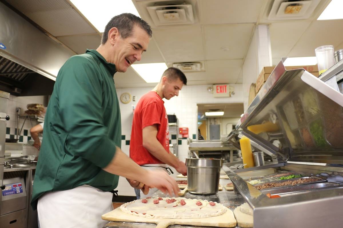 Sammy's artists creating pizza